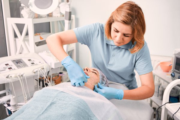 beautician-pulling-off-cosmetic-mask-from-woman-face (1)